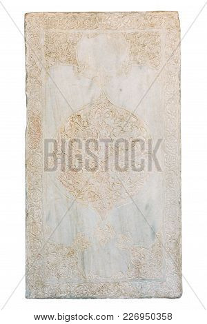 Carved Medieval Arabic Pattern On A Marble Slab Isolated On White
