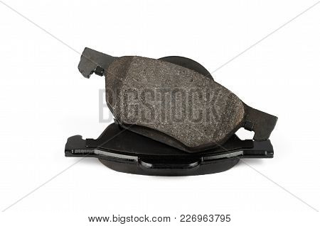 New Car Brake Pads Isolated On White. Set Of Spare Brake Pads For One Wheel.