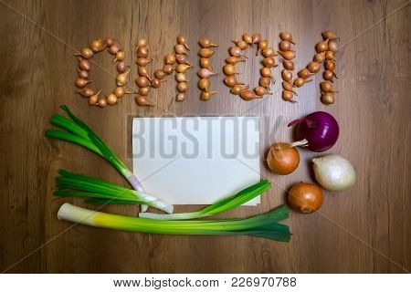 Onion, The Word Onion Is Written In Small Bulbs. Top View, Place For The Text