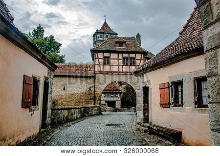 The Stronghold Gate In The Medieval Town Rothenburg Ob Der Tauber In A Beautiful Light , Germany.