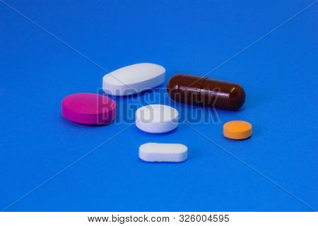 Pharmacy And Hospital Theme. Mix Of Pills And Capsules With Multivitamin And Tablets For Flu And Fev