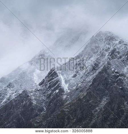 Stunning Detail Landscape Images Of Snowcapped Pen Yr Ole Wen Mountain In Snowdonia During Dramatic 