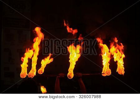 Man Entertains The Audience With The Help Of Fire During The Perehera In Srilanka