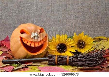 Pumpkin For Halloween Carved In The Shape Of A Smile. Jack Lantern Head Carved From Pumpkin For Hall