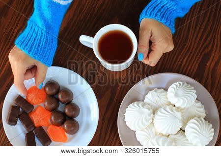 Women's Hands, A Cup Of Tea, A Woman Takes Marmalade. A Dish Of Marshmallows, Sweets And Marmalade, 