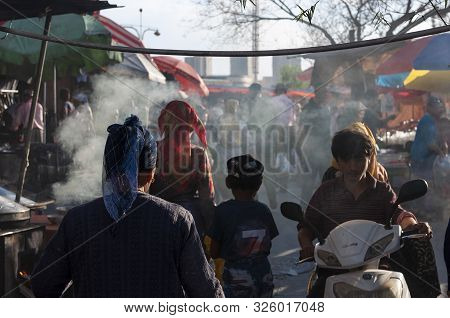 Kashgar, Xinjiang, China - August 16, 2012: People In A Street Market In The City Of Kashgar, Xinjia
