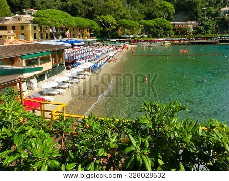 The Sand Beach Known As Paraggi Near Portofino In Genoa On A Blue Sky And Sea Background
