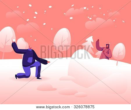 Happy Young Couple Playing Snowballs Fight On Snowy Winter Landscape Outdoors Background. Girl Hidin