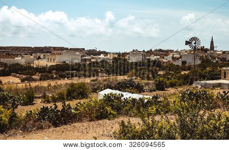 Hill With Terraced Fields For Agriculture And Old Buildings In Ghajnsielem, Gozo Island, Malta
