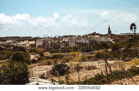 Hill With Terraced Fields For Agriculture And Old Buildings In Ghajnsielem, Gozo Island, Malta