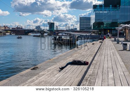 Copenhagen, Denmark - May 04, 2019: People Relax On One Of The Waterfronts Near The Blox - Danish Ar