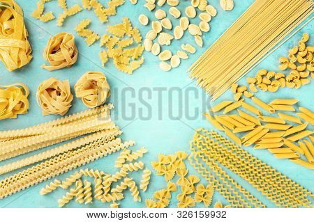 Italian Pasta, Flat Lay Banner With Copy Space, An Overhead Shot On A Teal Blue Background, A Design
