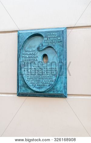 Krakow, Poland - July 27, 2019: Memorial Plaque Salon Of Polish Painters Of Henryk Frist.