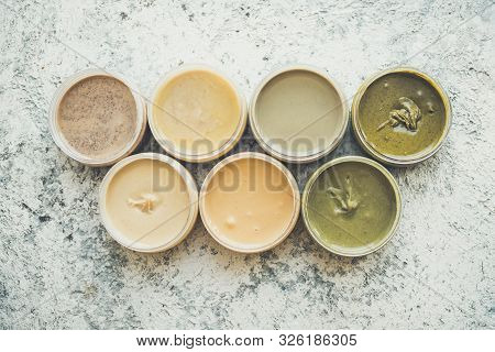 Nuts And Seeds Butter In Glass Jars. Homemade Raw Organic Peanut, Almond, Hazlenut, Cashew, Pistachi