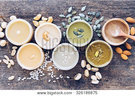 Nuts And Seeds Butter With Ingredients. Homemade Raw Organic Peanut, Almond, Hazlenut, Cashew, Pista