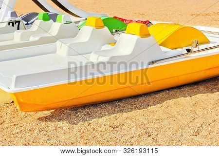 Catamaran On The Seashore. Sea Holiday. Yellow