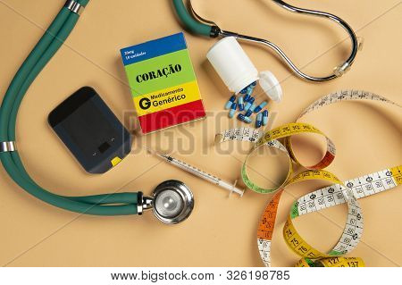 Fake Medicine Box With The Name Of The Disease Coracao And A Glucometer