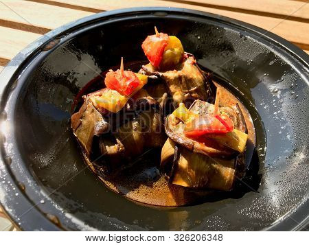 Turkish Islim Kofte / Kofta Kebab With Meatballs And Cherry Tomatoes Wrapped In Eggplant / Aubergine