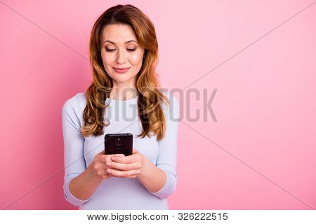 Portrait Of Focused Charming Woman Using Her Cellphone Read Feednews Information About Multimedia We