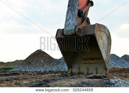Excavator In Working In A Quarry. Excavator Bucket. Large Metal Iron Ladle.