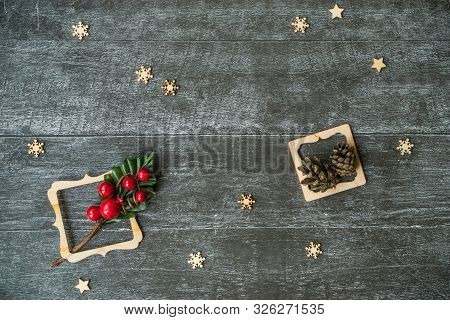 Christmas Background With Decorative Composition Of Wooden Frame, Pine Cone And Snowflakes On Wooden