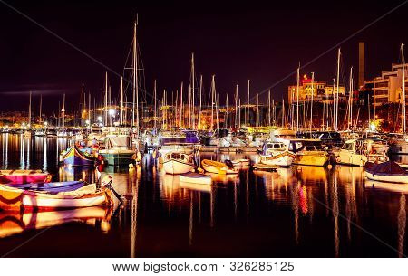 Small Boats Anchored In The Bay At Night, Msida Yacht Marina, Malta