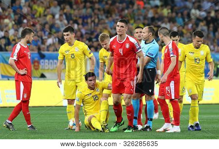 Lviv, Ukraine - June 7, 2019: Nikola Milenkovic Of Serbia (#4) Helps Roman Yaremchuk Of Ukraine (#18