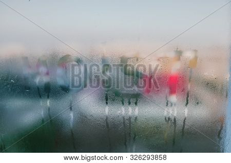 Moist Word Written On Wet Window. High Level Of Dampness In Apartment. Window Glass With High Air Hu