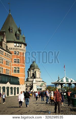 QUEBEC-CANADA, SEPT 12, 2019:  People walking on Terrasse Dufferin close the Chateau Frontenac, an historic hotel in Quebec City, Quebec, Canada, one of the most photographed in the world.