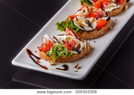 Bruschetta With Tomatoes, Lettuce, Camambert, Balsamic Vinegar