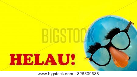 Helau German Greeting For Carnival - With Blue Ballon With Funny Mask On Yellow Background