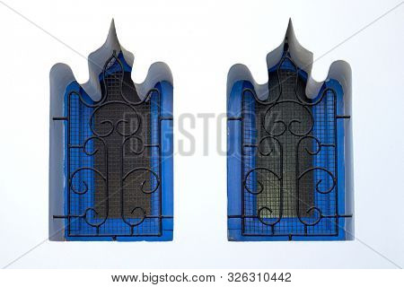 Moroccan window design with a metal railing in Asilah, Northern Morocco