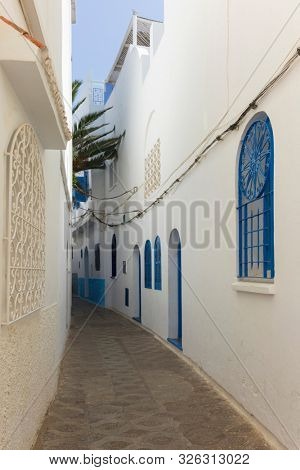 Narrow old street  in the medina of Asilah, Morocco