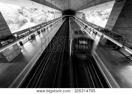 Sao Paulo, Brazil - 05, October, 2019: Black And White Picture Of Moving Train At Sumare Metro Stati