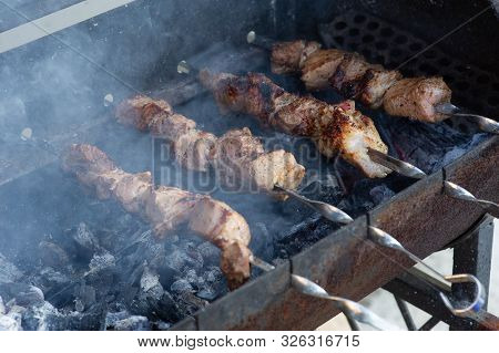 Skewers On Skewers.roasted Meat Cooked At Barbecue.bbq Fresh Beef Meat Chop Slices. Traditional East