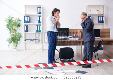 Forensic investigator investigating theft in the office