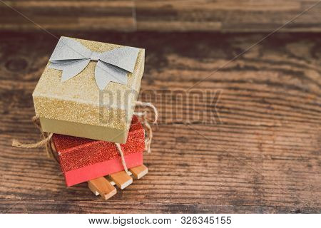Christmas Present Box With Bow And Glitters, Concept Of Gift Giving And Seasonal Holiday Shopping