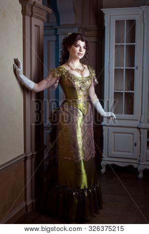 Elegant Woman In A Magnificent Dress. The Dress In Retro Style Is Magnificent And Openwork.