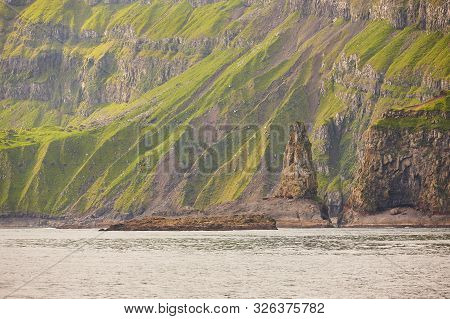 Scenic Green Rocky Mountain Fjord Landscape In Faroe Islands. Vagar