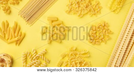 A Panorama Of Italian Pasta, Shot From The Top On A Yellow Background, A Flat Lay Banner