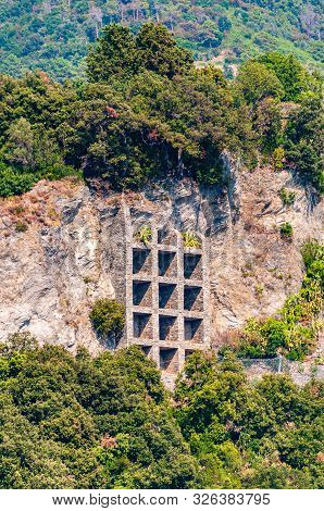 Supporting Structure Construction With Multiple Square Shapes Net Holding Rocky Cliff And Prevents F