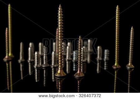Lot Of Whole Metallic Glossy Bolt City Isolated On Black Glass