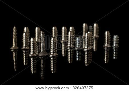 Lot Of Whole Metallic Glossy Bolt City Isolated On Black Glass