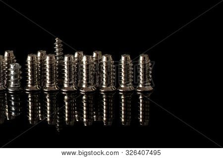 Group Of Fourteen Whole Metallic Glossy Bolt Isolated On Black Glass