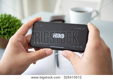 Anapa, Russia - October 3, 2019: Man Hand Holding Apple Iphone 11 With Multinational Entertainment C