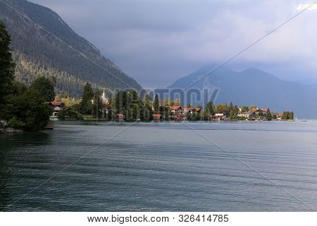 Cloudy Day At Lake Walchensee With Herzogstand Mountain Jochberg, Germany