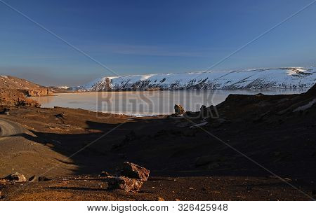The Winter Colours Of Beautiful Kerio, Or Kerid Crater In Western Iceland. Red Volcanic Rock