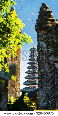Pura Ulun Danu Beratan temple seen through a stone gate in Bali, Indonesia