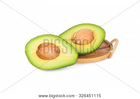Whole And Sliced Pinkerton Avocado On White Background
