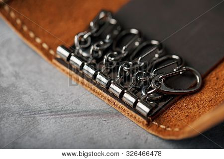 Wallet Keymaster Made Of Brown Genuine Leather, Handmade On A Dark Background